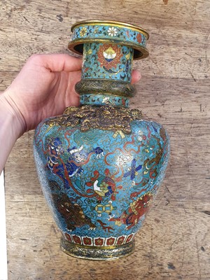 Lot 35 - A CHINESE GILT BRONZE AND CLOISONNÉ ENAMEL 'LION DOGS' BUDDHIST LONGEVITY VASE, BUMPA.