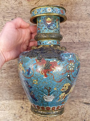 Lot 35 - A CHINESE GILT BRONZE AND CLOISONNÉ ENAMEL 'LION DOGS' BUDDHIST LONGEVITY VASE, BUMPA.