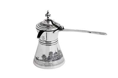 Lot 308 - An early 20th century Iraqi silver and niello Turkish coffee pot (cezva), Baghdad dated 1928 signed Baghdad Onaisi (Onaisi Al Fayyadh)