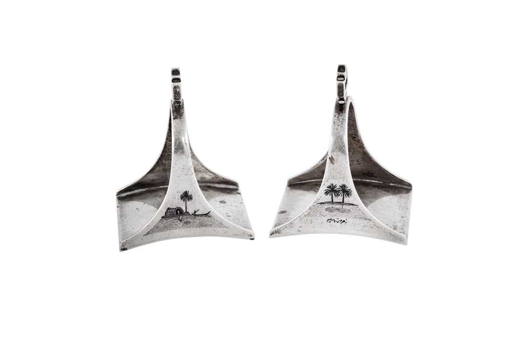 Lot 285 - A pair of early 20th century Iraqi silver and niello napkin rings, Basra circa 1920 signed Zahroon and Saleem