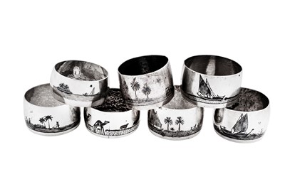 Lot 175 - A mixed group of seven early 20th century Iraqi silver and niello napkin rings, Basra circa 1920-40