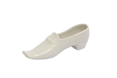 Lot 77 - A CHINESE BLANC-DE-CHINE MODEL OF A SHOE.
