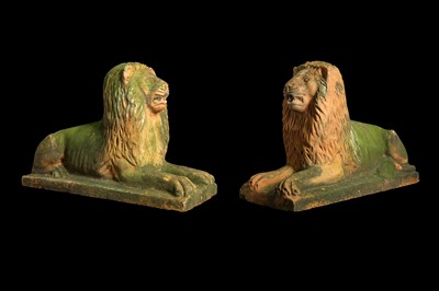 Lot 260 - A PAIR OF 19TH / EARLY 20TH CENTURY TERRACOTTA MODELS OF RECLINING LIONS