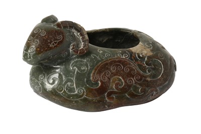 Lot 717 - A CHINESE GREEN JADE 'RAM' WASHER