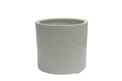 Lot 593 - A CHINESE WHITE-GLAZED 'DRAGON' BRUSH POT.