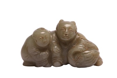Lot 652 - A CHINESE PALE CELADON JADE 'BOYS' GROUP.