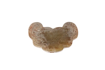 Lot 645 - A CHINESE PALE CELADON JADE TAOTIE MASK.