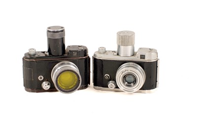 Lot 221 - A Black Luftwaffen Eigentum Robot Camera & One Other.