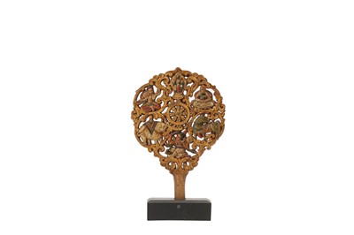 Lot 489 - A TIBETAN WOOD 'SEVEN GEMS' TORMA PLAQUE.