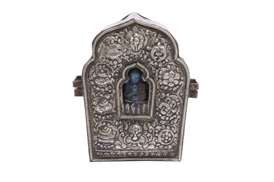 Lot 813 - A TIBETAN COPPER AND SILVER GAU.
