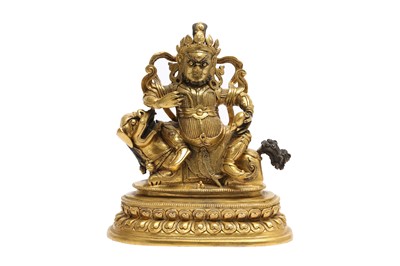 Lot 177 - A SINO-TIBETAN GILT BRONZE FIGURE OF VAISHRAVANA.