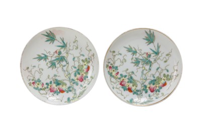 Lot 426 - A PAIR OF CHINESE FAMILLE ROSE 'BITTER MELLON' SAUCERS.