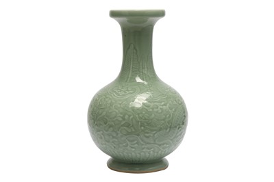 Lot 473 - A CHINESE CELADON 'DRAGON' BOTTLE VASE.

A CHINESE CELADON 'DRAGON' BOTTLE VASE.