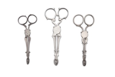Lot 362 - A pair of George II sterling silver tea tongs / sugar nips, London circa 1750 by P.G in a shaped rectangular punch (untraced)