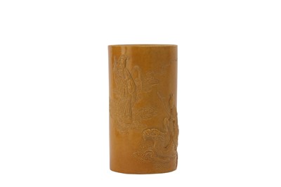 Lot 61 - A CHINESE YELLOW-GLAZED BISCUIT ‘HE XIANGU AND LU DONGBIN’ BRUSH POT.