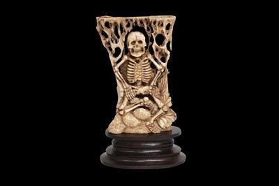 Lot 115 - HAND-CARVED WATER BUFFALO SHOULDER BLADE OF A SKELETON ON WOOD PLINTH