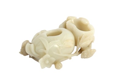 Lot 575 - A CHINESE PALE CELADON JADE 'PEACH AND LINGZHI' WASHER.