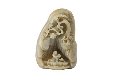 Lot 569 - A CHINESE PALE CELADON JADE 'LIU HAI' BOULDER.