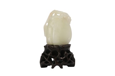 Lot 630 - A CHINESE PALE CELADON JADE 'LOQUAT' CARVING.