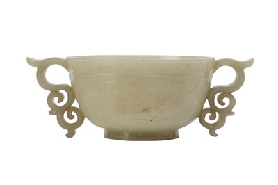 Lot 571 - A CHINESE PALE CELADON JADE ARCHAISTIC CUP.
