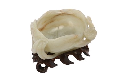 Lot 516 - A CHINESE PALE CELADON JADE 'LOTUS LEAF' WASHER.
