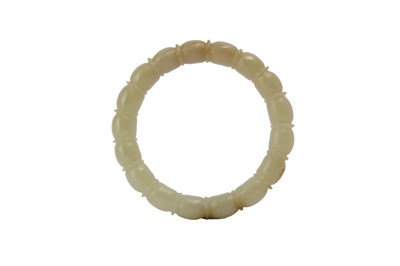 Lot 861 - A CHINESE PALE CELADON JADE BANGLE.