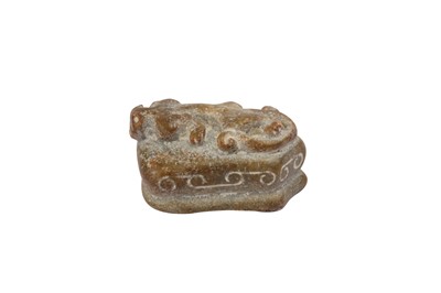 Lot 697 - A CHINESE CELADON JADE 'CHILONG' TOGGLE.
