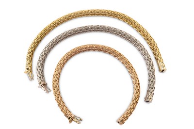 Lot 95 - A set of tri-coloured bracelets