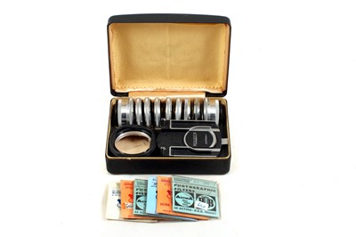 Lot 344 - A Rollei Bayonet II Lens Hood & Filter Set.