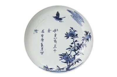 Lot 664 - A CHINESE BLUE AND WHITE 'BIRD AND FLOWERS' DISH.