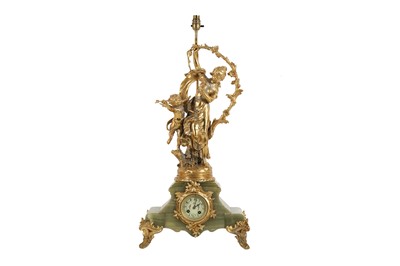 Lot 95 - A FRENCH GILT METAL AND GREEN ONYX FIGURAL MANTLE CLOCK, EARLY 20TH CENTURY