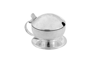 Lot 434 - A George V ‘arts and crafts’ sterling silver mustard pot, Birmingham 1912 by Liberty and Co