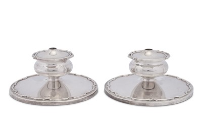 Lot 556 - A pair of Elizabeth II combination dwarf candlesticks and tapersticks, Sheffield 1957 by Walker and Hall