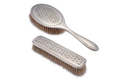 Lot 435 - A George V ‘Arts and Crafts’ sterling silver brush set, Birmingham 1916 marked for Liberty and Co, designed by Bernard Cuzner (1877-1956)