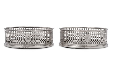 Lot 508 - A pair of George III sterling silver wine coasters, London 1773 by I.W possibly for John Weldring (Grimwade 3699)