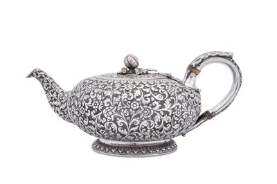 Lot 207 - A rare mid-19th century Anglo – Indian silver teapot, Cutch, Bhuj, circa 1860 by Oomersi Mawji (active 1860-90)