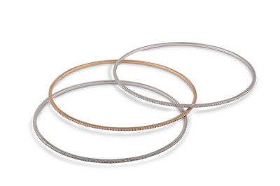 Lot 100 - A set of diamond stacking bangles