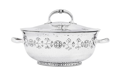Lot 433 - A George V ‘Arts and Crafts’ sterling silver covered twin handled bowl, Birmingham 1911 by William Hair Haseler