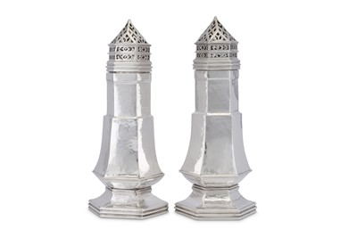 Lot 437 - A pair of George V Arts and Crafts sterling silver sugar casters, London 1930/33 by Omar Ramsden (1873–1939)