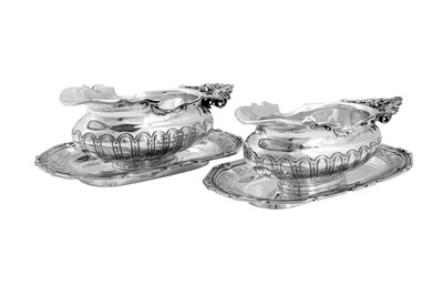 Lot 138 - A pair of early 20th century French 950 standard silver sauceboats on stands, Paris circa 1910 by Cardeilhac