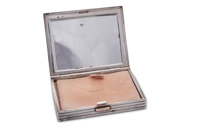 Lot 40 - A mid-20th century French 950 standard silver and 18 carat gold mounted compact, Paris dated 1954, retailed by Cartier