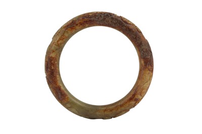Lot 67 - A CHINESE PALE CELADON JADE 'CHILONG' BANGLE.