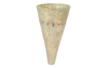 Lot 262 - A SASSANIAN FREE-BLOWN TRANSPARENT GLASS BEAKER