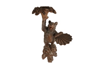 Lot 206 - A LATE 19TH / EARLY 20TH CENTURY BLACK FOREST CARVED BEAR TORCHERE STAND