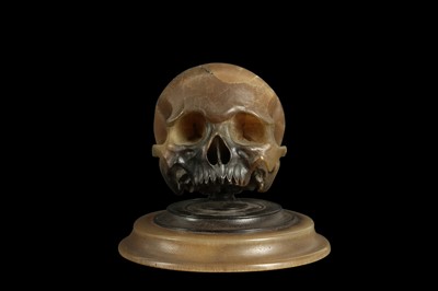Lot 6 - A RARE 17TH CENTURY GERMAN RHINOCEROS HORN  MODEL OF A HUMAN SKULL
