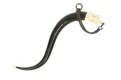 Lot 384 - λ A MAKARA-SHAPED BUFFALO HORN POWDER FLASK