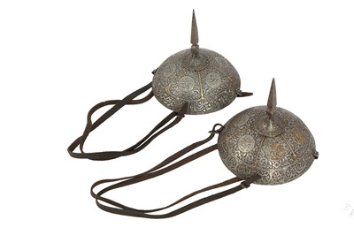 Lot 251 - A PAIR OF ENGRAVED AND GOLD-DAMASCENED STEEL KNEE COVERS