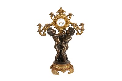 Lot 75 - A FINE NAPOLEON III GILT AND PATINATED BRONZE CANDELABRA CLOCK BY JULES GRAUX, PARIS, CIRCA 1860
