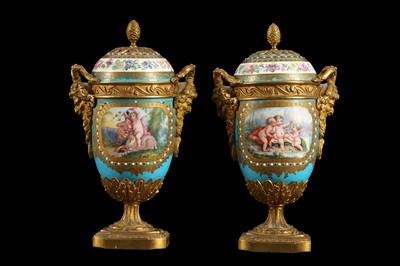 Lot 52 - A PAIR OF 19TH CENTURY FRENCH SEVRES STYLE PORCELAIN AND ORMOLU MOUNTED URNS AND COVERS