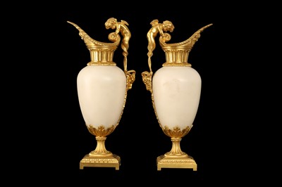 Lot 57 - A FINE PAIR OF 19TH CENTURY FRENCH CARRARA MARBLE AND ORMOLU EWERS